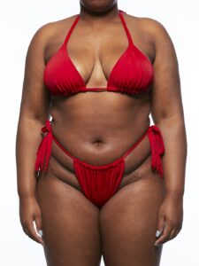 Model wearing red bikini top and bottoms.