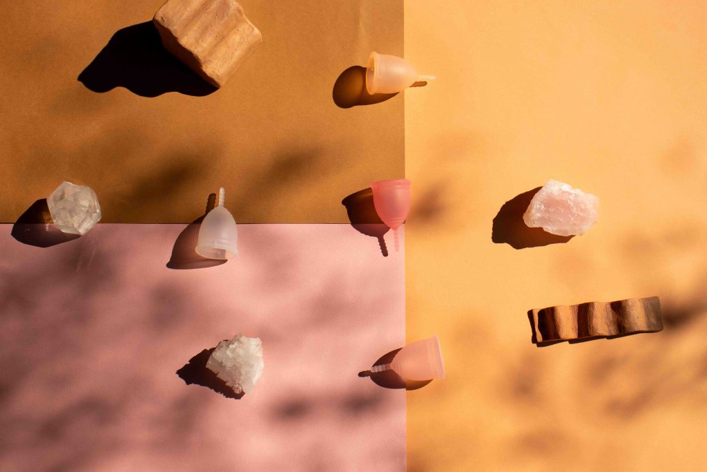 menstrual cups with crystals around it