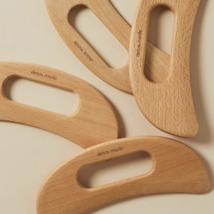 Wooden body sculpter in shape of crescent moon